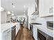 Open-concept kitchen with stainless steel appliances, a large island, and hardwood floors at 677 Brennan Dr, Decatur, GA 30033