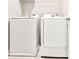White washer and dryer inside with an overhead wire shelf at 677 Brennan Dr, Decatur, GA 30033