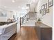 Spacious living room featuring hardwood floors, staircase, and a glimpse of an open kitchen at 677 Brennan Dr, Decatur, GA 30033
