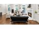 Bright living room features a fireplace, hardwood floors, and large windows for natural light at 677 Brennan Dr, Decatur, GA 30033