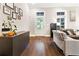 Bright living room featuring hardwood floors, neutral paint, and comfortable seating arrangement at 677 Brennan Dr, Decatur, GA 30033