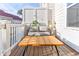 Comfortable patio with a wooden table, and a neutral couch at 677 Brennan Dr, Decatur, GA 30033