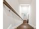 Wooden staircase with carpet runner leads to the upper level with natural light at 677 Brennan Dr, Decatur, GA 30033