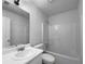 Well-lit bathroom featuring a single sink vanity and a shower-tub combo at 1090 Ohara Dr, Jonesboro, GA 30236