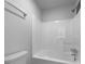 Full bathroom featuring white tub surround and neutral toilet at 1090 Ohara Dr, Jonesboro, GA 30236