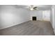 Bright living room with plush carpet, ceiling fan, and fireplace providing a cozy focal point at 1090 Ohara Dr, Jonesboro, GA 30236