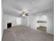 Open-concept living room with a fireplace and view into the white kitchen at 1090 Ohara Dr, Jonesboro, GA 30236