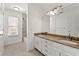 Bright bathroom features a double vanity with granite countertop and white cabinets, plus a tiled shower-tub combo at 3744 Misty Wood Nw Dr, Marietta, GA 30064