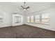 Spacious bedroom featuring vaulted ceiling, ceiling fan, neutral color palette, and large windows at 3744 Misty Wood Nw Dr, Marietta, GA 30064