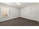 Bedroom featuring a neutral paint scheme and a large window at 3744 Misty Wood Nw Dr, Marietta, GA 30064