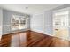 Dining room with rich hardwood floors, decorative molding, and modern pendant lighting at 3744 Misty Wood Nw Dr, Marietta, GA 30064