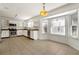 Bright kitchen boasts stainless appliances, lots of windows, and tile floors at 3744 Misty Wood Nw Dr, Marietta, GA 30064