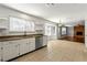 Bright kitchen with granite countertops, stainless steel appliances, and tile flooring at 3744 Misty Wood Nw Dr, Marietta, GA 30064