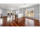 Open living room featuring rich hardwood floors and lots of natural light at 3744 Misty Wood Nw Dr, Marietta, GA 30064