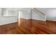 Open-concept living space with hardwood floors and neutral gray walls at 3744 Misty Wood Nw Dr, Marietta, GA 30064