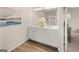 Bright main bathroom featuring double sinks, white cabinets and modern finishes at 6334 Rosetta Dr, South Fulton, GA 30331