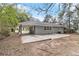 Backyard view of the house featuring a covered patio and an expansive yard at 1145 Canal St, Decatur, GA 30032