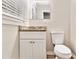 Clean bathroom with white vanity, granite countertop, and a convenient toilet setup at 1145 Canal St, Decatur, GA 30032