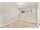 Cozy bedroom with neutral carpet, paneled walls, and a well-lit atmosphere from a bright window at 1145 Canal St, Decatur, GA 30032