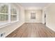 Spacious living area with laminate floors and natural light pouring in through the large windows at 1145 Canal St, Decatur, GA 30032