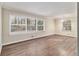 Bright living room featuring hardwood floors and large windows, offering plenty of natural light at 1145 Canal St, Decatur, GA 30032