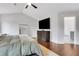 Well lit bedroom featuring hardwood floors, a dresser, and a mirror at 2383 Colonial Ne Dr, Brookhaven, GA 30319