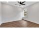 Well-lit bedroom with hard wood floors, a ceiling fan and natural lighting at 2383 Colonial Ne Dr, Brookhaven, GA 30319