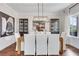 Formal dining room with stylish chandelier, hardwood floors, and neutral decor for elegant dining at 2383 Colonial Ne Dr, Brookhaven, GA 30319