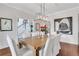 Formal dining room with stylish chandelier, hardwood floors, and neutral decor for elegant dining at 2383 Colonial Ne Dr, Brookhaven, GA 30319