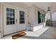 Inviting front porch with a welcoming mat, stylish lighting, and classic design elements at 2383 Colonial Ne Dr, Brookhaven, GA 30319