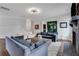 Bright living room featuring hardwood floors, a modern ceiling light, and two plush couches at 2383 Colonial Ne Dr, Brookhaven, GA 30319