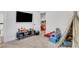 Bright playroom with a TV, toys, and a cozy play area for  at 2383 Colonial Ne Dr, Brookhaven, GA 30319