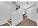 Bright staircase showcasing wood floors and a modern design with white walls at 2383 Colonial Ne Dr, Brookhaven, GA 30319