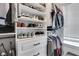 Well-organized walk-in closet featuring built-in shelving and ample hanging space at 2383 Colonial Ne Dr, Brookhaven, GA 30319