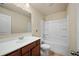 Bathroom features a white vanity, a toilet, and a shower-tub combo at 2592 Jacanar Sw Ln, Atlanta, GA 30331