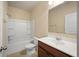 Bathroom with tub/shower combo, toilet, sink and wood vanity at 2592 Jacanar Sw Ln, Atlanta, GA 30331