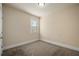 Neutral bedroom features plush carpet, white trim, and a window with blinds at 2592 Jacanar Sw Ln, Atlanta, GA 30331