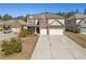 Charming two-story home featuring a brick facade, a two-car garage, and a well-manicured front yard at 2592 Jacanar Sw Ln, Atlanta, GA 30331