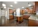 Spacious kitchen featuring stainless steel appliances, granite countertops, and dark wood cabinetry at 2592 Jacanar Sw Ln, Atlanta, GA 30331