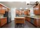 Spacious kitchen featuring stainless steel appliances, granite countertops, and dark wood cabinetry at 2592 Jacanar Sw Ln, Atlanta, GA 30331