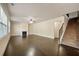 Spacious living room featuring hardwood floors, fireplace, and plenty of natural light at 2592 Jacanar Sw Ln, Atlanta, GA 30331