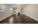 Bright living room features hardwood floors, a fireplace, and large windows for natural light at 2592 Jacanar Sw Ln, Atlanta, GA 30331