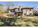 Large backyard featuring a lush lawn, mature trees, and a multi-level deck with stairs at 3979 Sentry Xing, Marietta, GA 30068