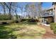 Well-manicured backyard featuring a lush lawn and a private fence, with a raised deck at 3979 Sentry Xing, Marietta, GA 30068