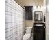 This bathroom is a standard design with a shower-tub combination and dark vanity at 3979 Sentry Xing, Marietta, GA 30068