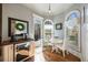 Cozy breakfast nook with a view of the outdoor deck, featuring a built-in wine cooler and beverage center at 3979 Sentry Xing, Marietta, GA 30068