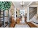 Bright and airy foyer with hardwood floors, staircase, and elegant columns leading to living spaces at 3979 Sentry Xing, Marietta, GA 30068