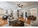 Spacious living room open to the kitchen and dining area, featuring hardwood floors and a neutral color palette at 3979 Sentry Xing, Marietta, GA 30068