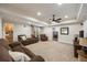 Cozy living room with plush seating, neutral carpet, recessed lighting, and access to other areas of the basement at 3979 Sentry Xing, Marietta, GA 30068