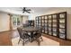 Bright storage room featuring hardwood floors, large windows, neutral paint and black shelving with clear containers at 3979 Sentry Xing, Marietta, GA 30068